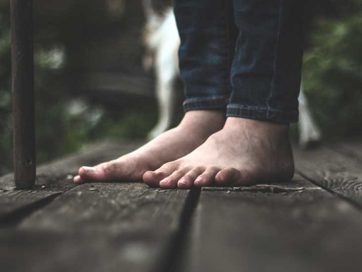 Walking Barefoot: Benefits, Potential. minimalist shoes on concrete. 