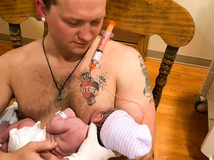 mom breastfeeding dad