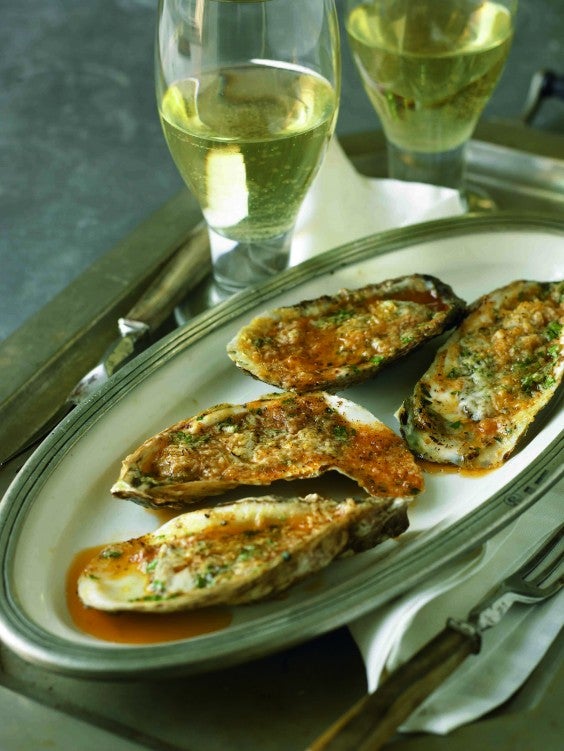 oysters grilled with roasted garlic butter and romano