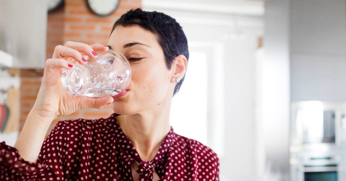 Female drinking water home facebook 1200x628
