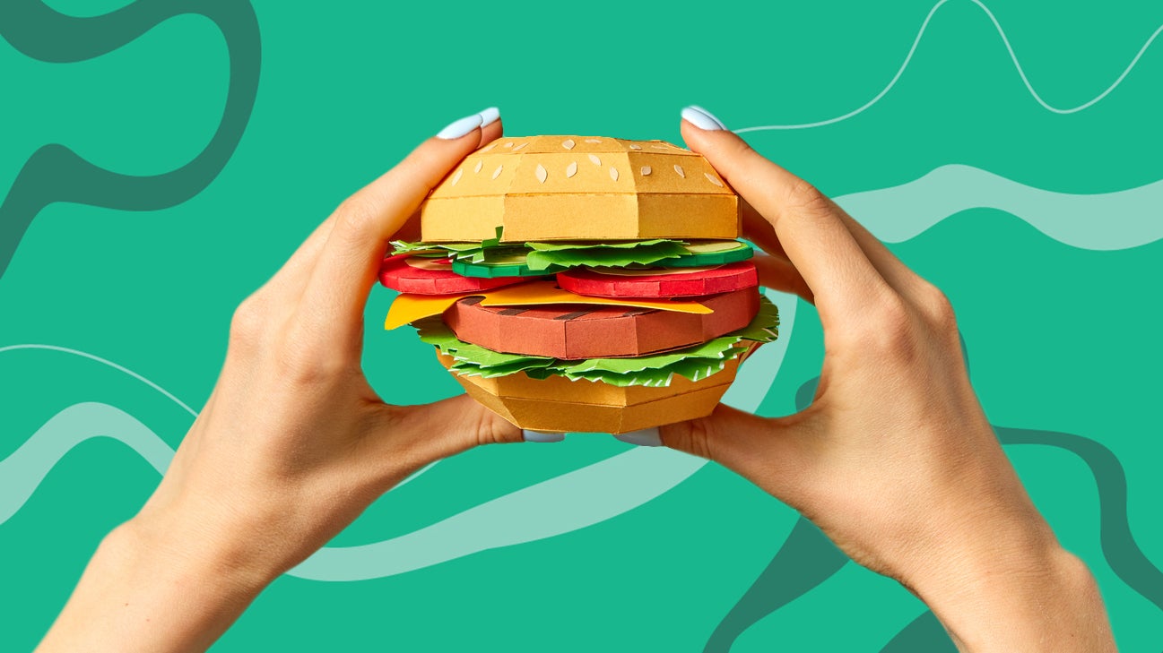 Hands holding a burger