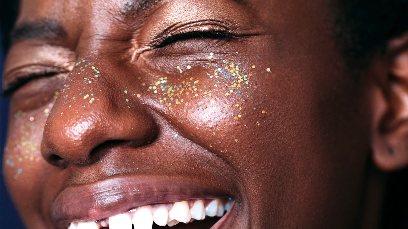 Woman smiling with eyes that have crow's feet header