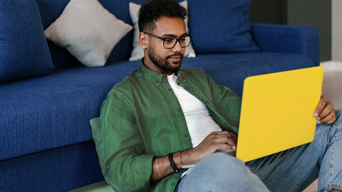 young man looking at his laptop