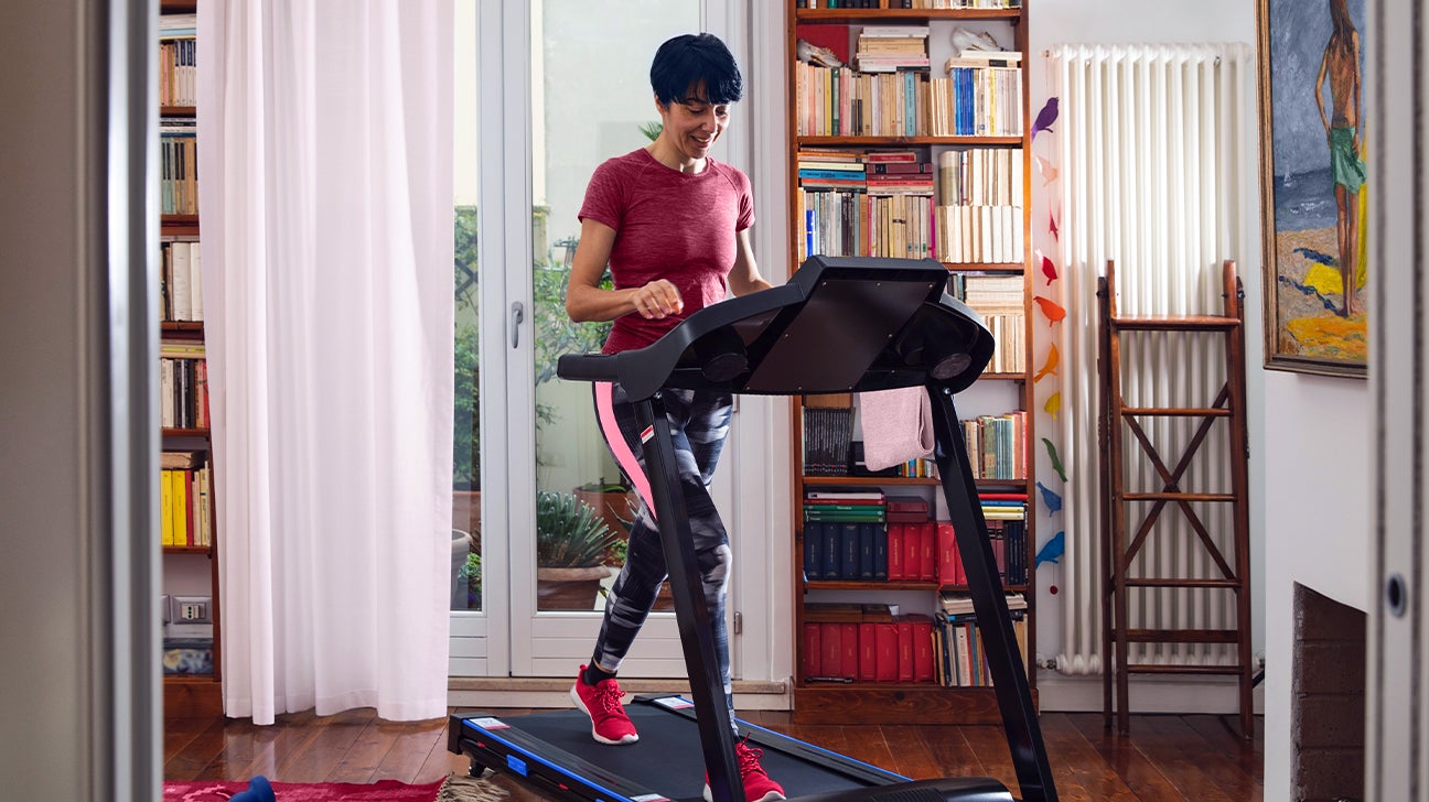 person running on a cheap treadmill