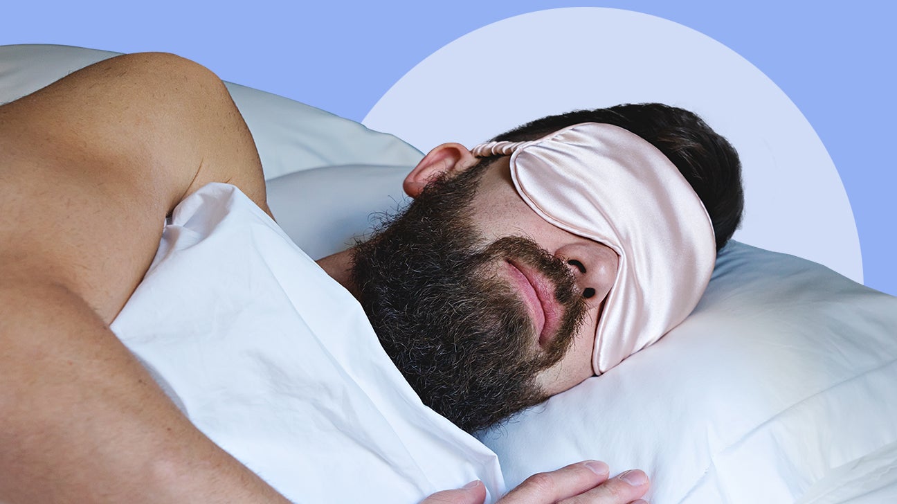 person sleeping with a sleep mask