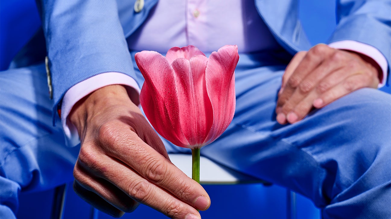 male holding flower representing vasectomy header