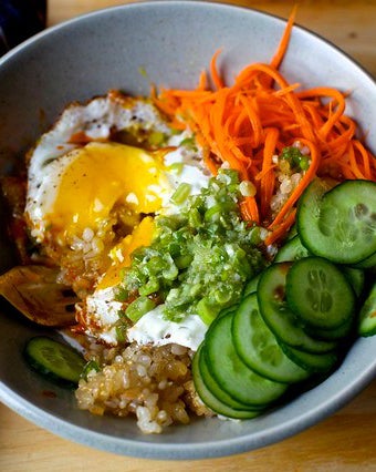 crispy egg and rice bowl with ginger scallion vinaigrette