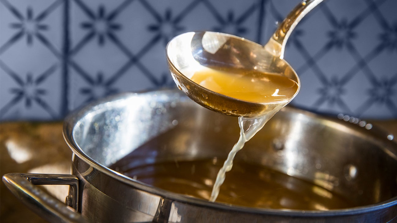 bone broth in ladle header