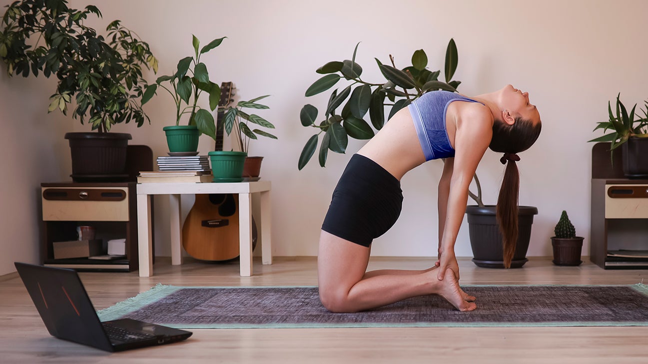 woman completing camel pose header