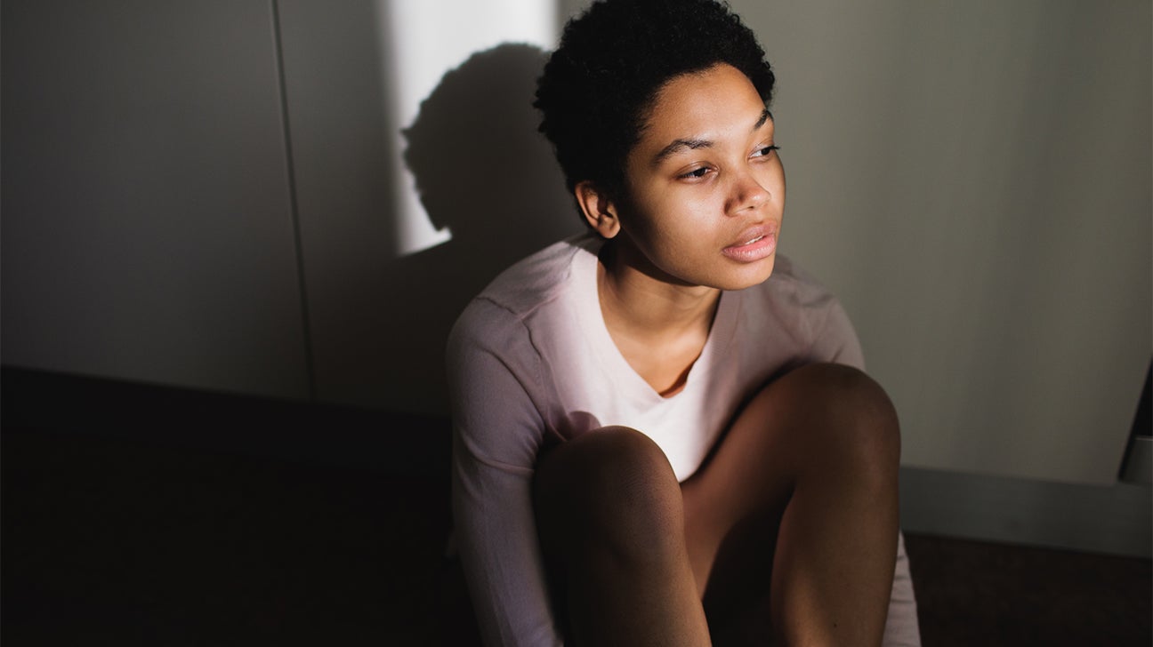 person sitting in light