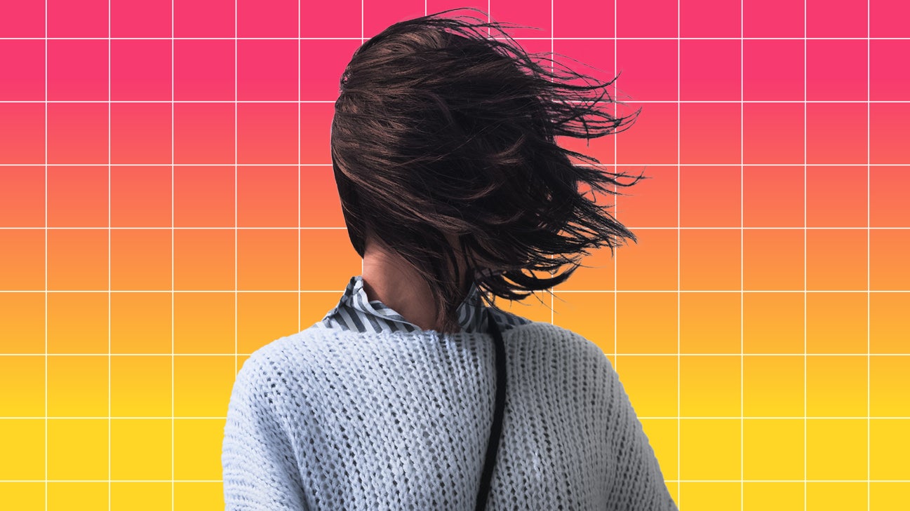 person experiencing migraine with hair covering face