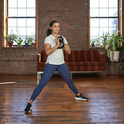person doing a goblet cossack squat with kettlebell