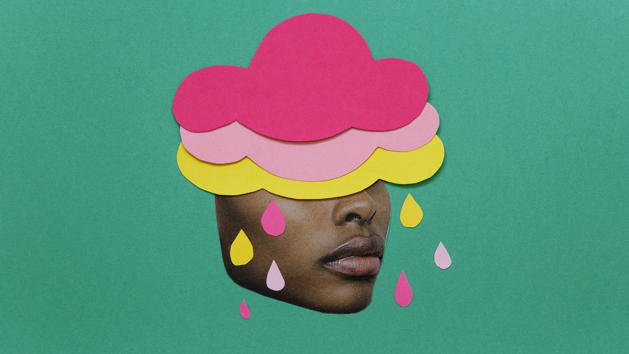 person with pink and yellow rain clouds over head