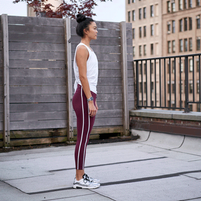 person doing standing forward fold
